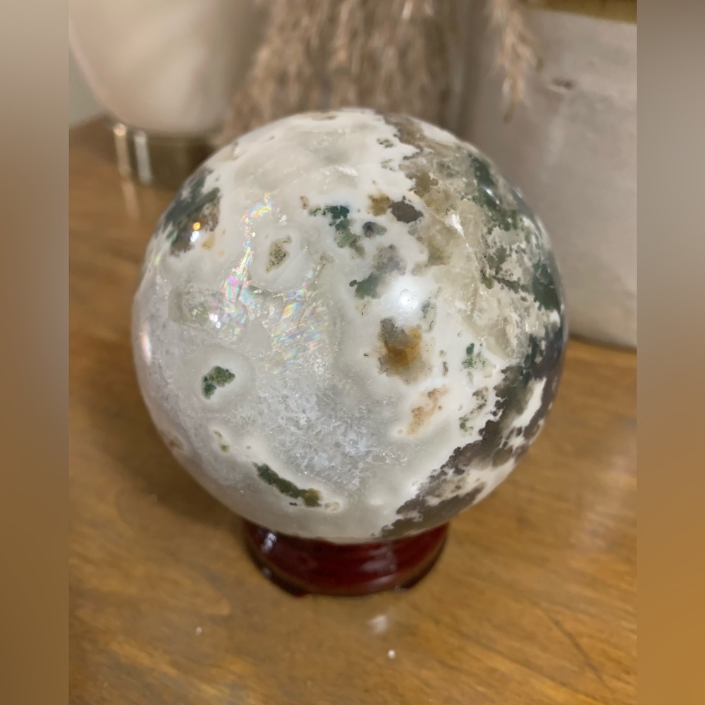 Moss agate sphere with rainbows